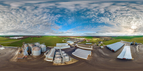 full seamless 360 hdri panorama view among farming field on rows of agro silos granary elevator with seeds cleaning line on agro-processing manufacturing plant in equirectangular spherical projection - obrazy, fototapety, plakaty