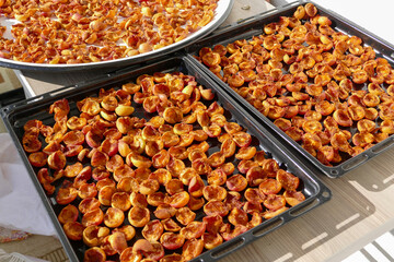 drying apricots on the balcony in the home environment, close-up dried apricots,