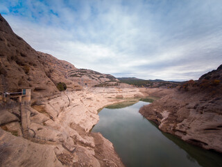 Photograph of the route of the hermitages in the Vadiello reservoir in the province of Huesca, Aragon, where you can see the Vadiello mallos in the Sierra de Guara. Spain.
