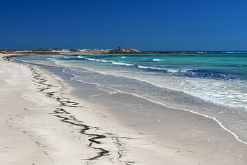 Fototapeta na wymiar Wonderful view of the lagoon, seashore, white sand beach and blue sea. Djerba Island, Tunisia