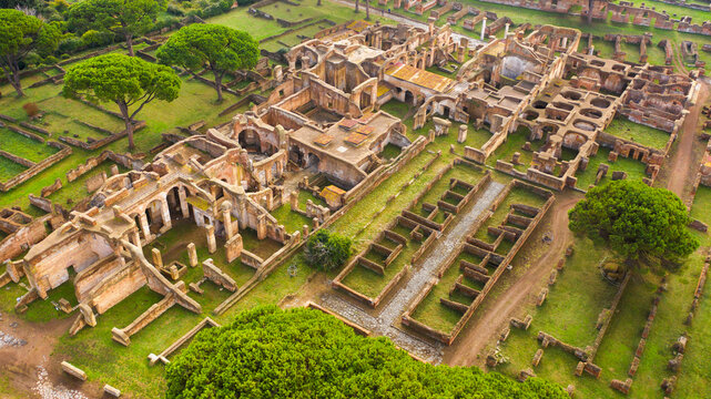 Aerial view of Baths of the Seven Sages. These ruins were thermal baths of Ostia Antica. In background there's the Sacellum of the Three Naves. The archaeological area is located in Ostia, Rome, Italy