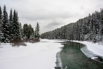 Bow River in winter with ice and snow, Lake Louise, Banff National Park