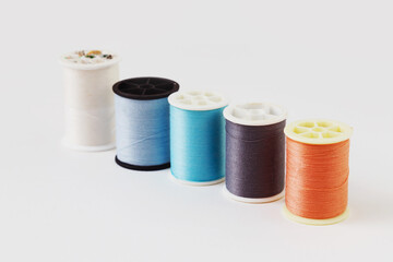 Yarn textile, Spool of colorful clothes sewing thread isolated on white