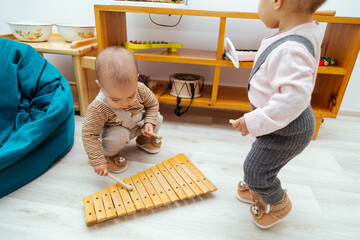 Toddler playing xylophone