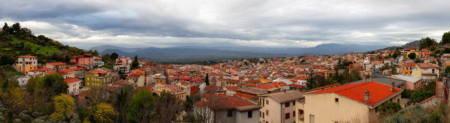 Fototapeta na wymiar View of small touristic town in the mountains. Dorgali, Sardinia, Italy. Panorama