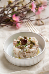 seabass tartare with capers olives and thymus