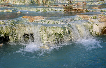The beautiful Cascate del Mulino, natural limestone pools and free spas of Saturnia, Grosseto,...
