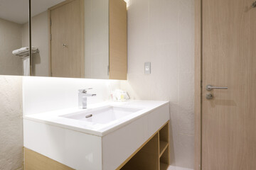 Fototapeta na wymiar Loft white tile bathroom corner, tub and sink