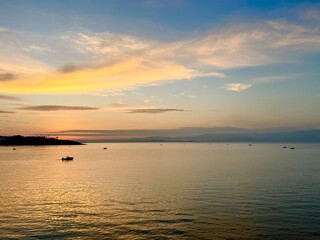 Naklejka na ściany i meble Seascape after the sunset, orange clouds at the seascape, golden hour