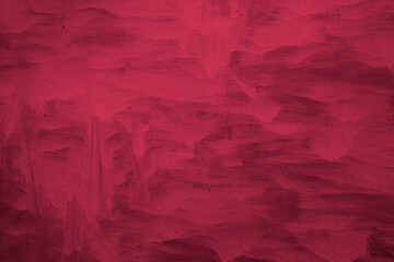 Old weathered painted surface with cracked paints magenta color trendy background