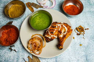 Tandoori chicken with chili sauce served in a dish isolated on grey background top view of bangladesh food