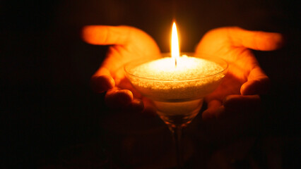 Blackout in Ukraine 2022. Life during war in Ukraine. Candles and love. Burning candle in the dark