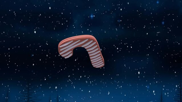 Animation of christmas candy cane gingerbread cookie over snow falling