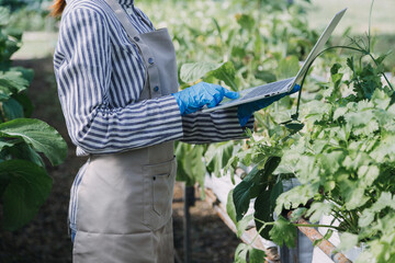 Futuristic businessman farms vegetables and crops using modern AI technology using mobile phones, temperature and humidity sensors, water tracking, climate control, holographic data data icons.