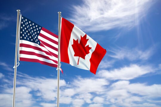 United States of America and Canada flags over blue sky background. 3D illustration