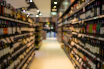 Blurred image of wine shelves display in supermarket