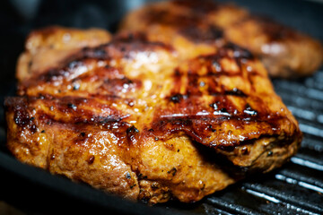 Seasoned sirloin steak on a grill pan. steak large. Selective focus