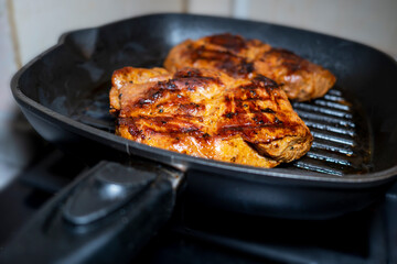 Seasoned sirloin steak on a grill pan. steak large. Selective focus