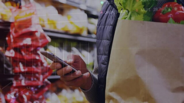 Animation of graphs, trading board over midsection of caucasian man using cellphone in supermarket