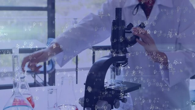 Animation of sums and abstract patterns over biracial scientist examining liquid through microscope