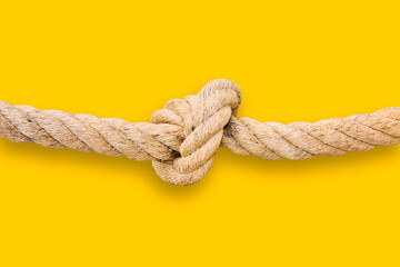 Untie the knots - problem solving concept image on yellow background