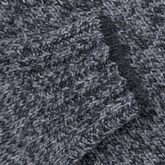 Grey melange wool sweater sleeve close up