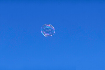 Soap bubble against blue sky