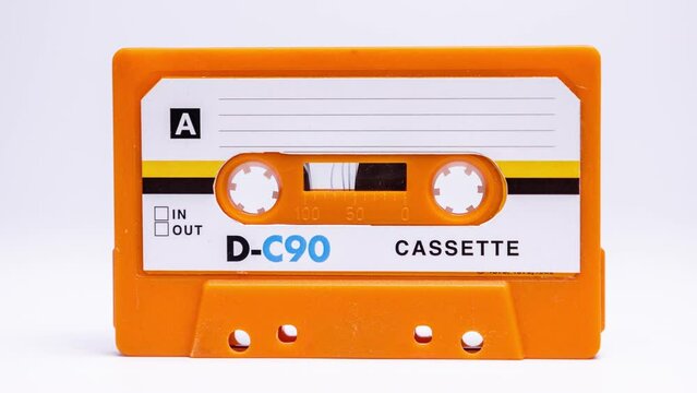 Cassette tape ovelayed with stereo speakers