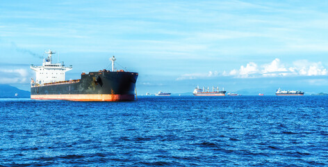 Cargo ships waiting to cross Panama Canal.