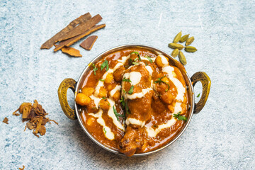 Jaipuri butter Chicken korma karahi masala with chili sauce served in a dish isolated on grey background top view of bangladesh food