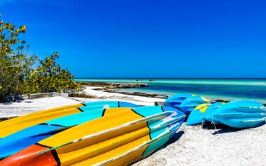 Canoes boats for water activities on the beach Holbox Mexico.