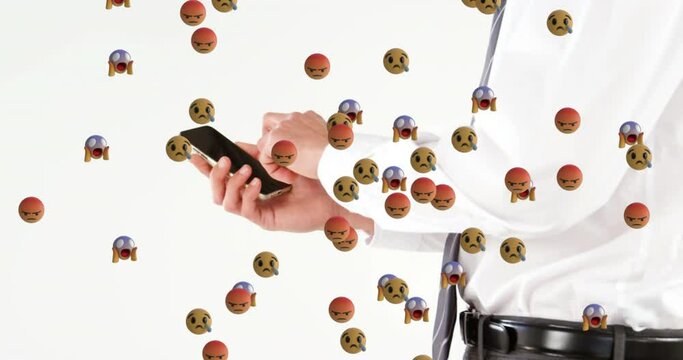 Animation of emoji icons over caucasian businessman using smartphone