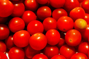 Cherry tomatoes. Cherry tomatoes close-up. Hard light. Bright light and shadow.