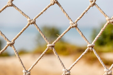 Safety net, fence, woven mesh at the beach
