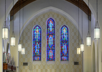 Three stained glass windows inside the historic Cathedral of St. John in downtown Albuquerque, New Mexico
