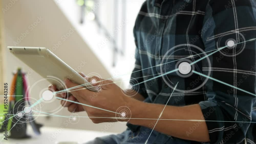 Poster animation of network of connections over mid section of man using digital tablet at home