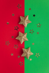 Golden sparkling stars on a red and green background.