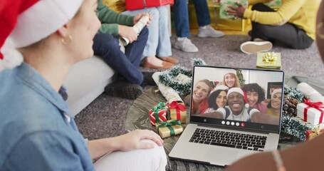 Diverse group of friends having christmas video call with diverse people - Powered by Adobe