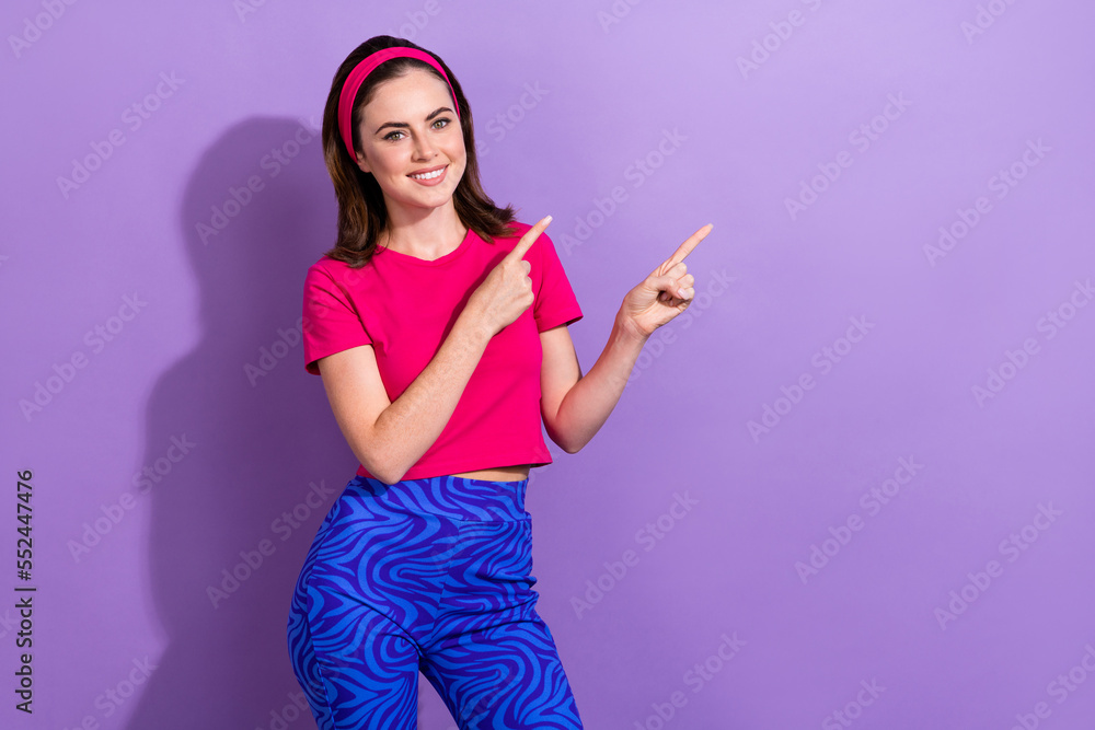 Sticker Portrait of pretty positive person indicate fingers empty space proposition isolated on purple color background