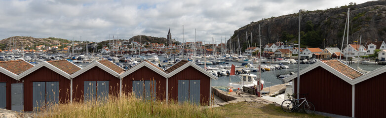 Fototapeta na wymiar Panoramic view from the picturesque marina of the beautiful coastal town of Fjällbacka in Sweden. 