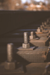 large metal bolts and nuts for fastening railway tracks