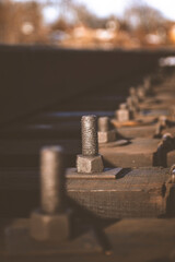large metal bolts and nuts for fastening railway tracks
