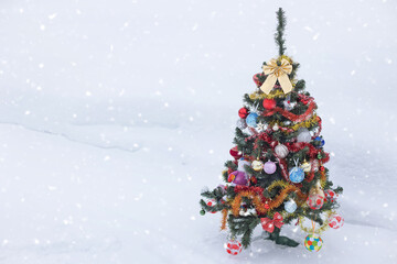 Decorated Christmas tree with gifts on nature background. Christmas holiday concept.