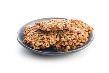 Oatmeal cookies on plate isolated on white background.