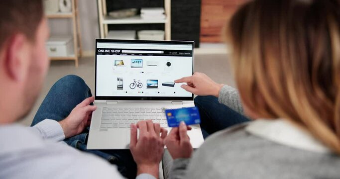 Close-up Of An Couple Shopping Online