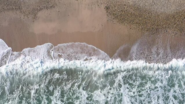top shot view over the sea shore on a sandy and rocky beach France 