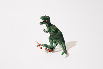 Tyrannosaurus rex on skateboard. White background.