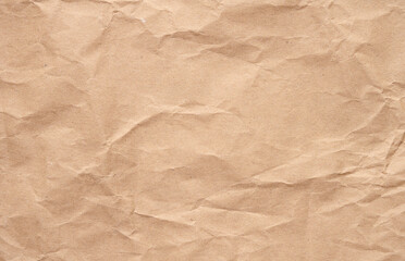 Texture of brown crumpled craft paper, full frame