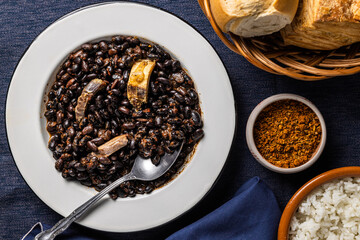 Top view of beans and pork, typical food from Brazil.