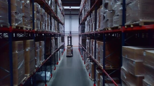 Huge shelves located close to each other. Creative. Long cabinets with shelves with parcels that are tightly packed.